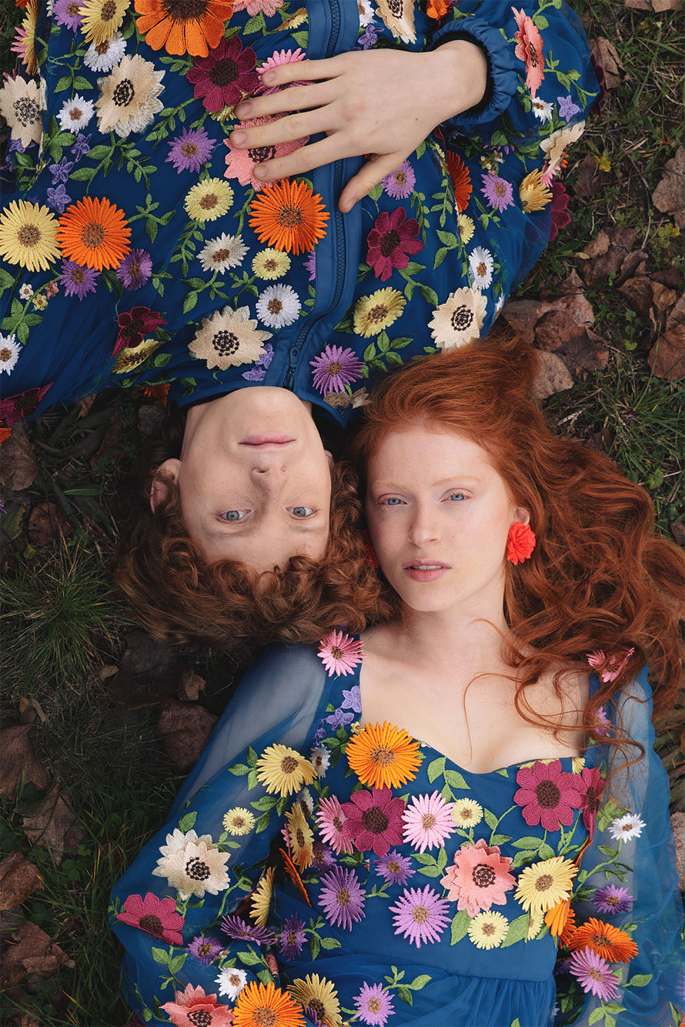 Blue floral embroidered dress worn by a model.