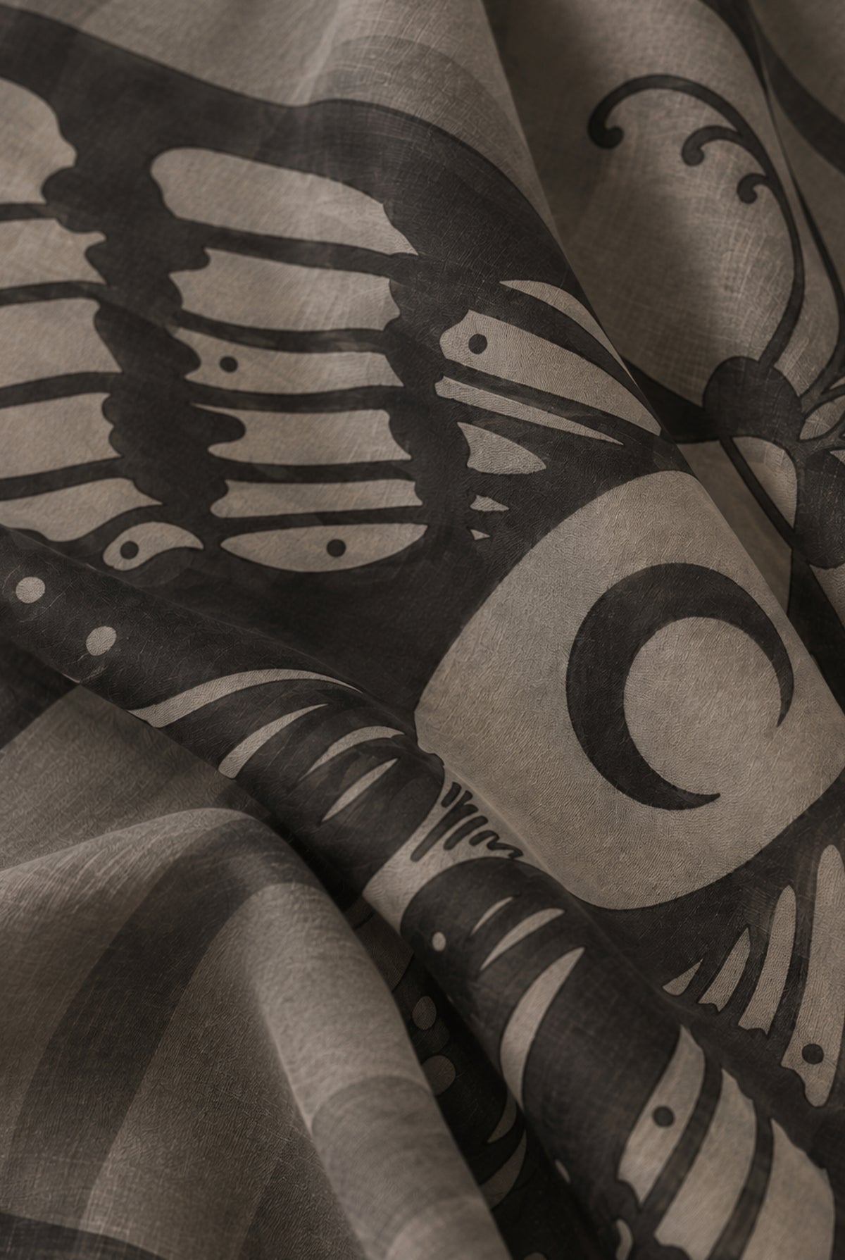 Close-up of the modal and cashmere fabric and the detailed moth illustration with anatomical wing patterns.