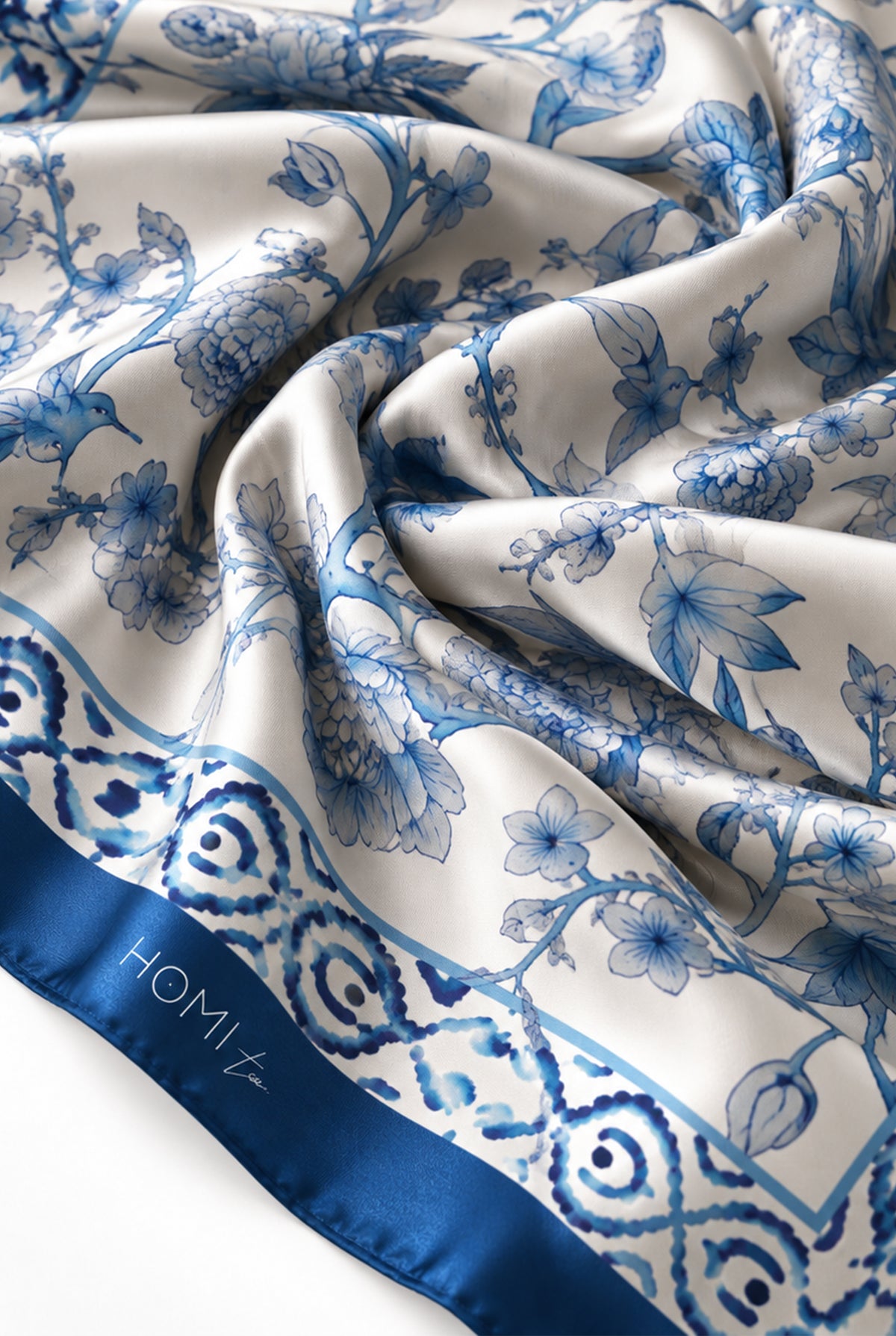 Close-up of the intricate blue and white floral botanical pattern and decorative border.