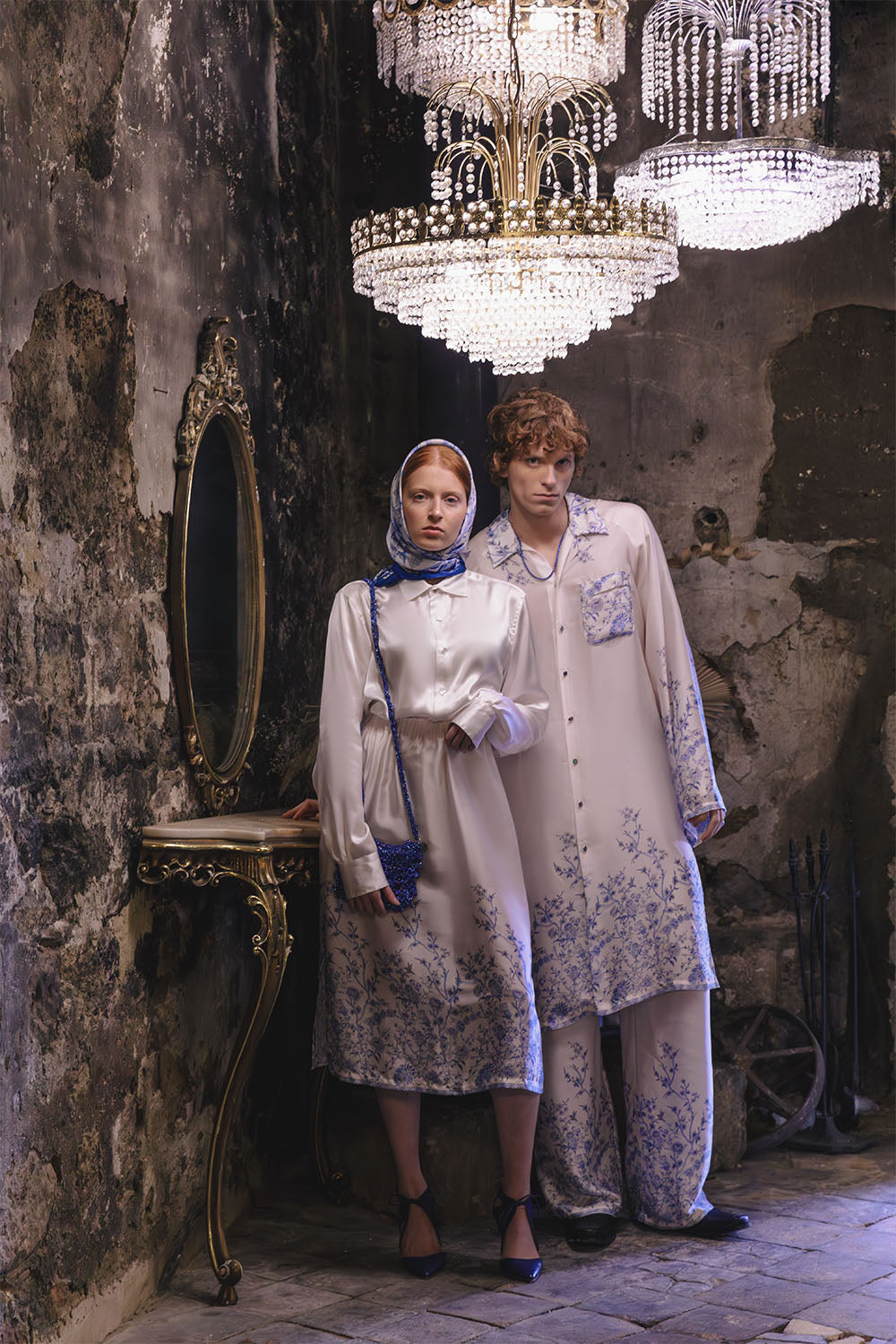 Ivory wide-leg trousers with blue floral details worn by a model.