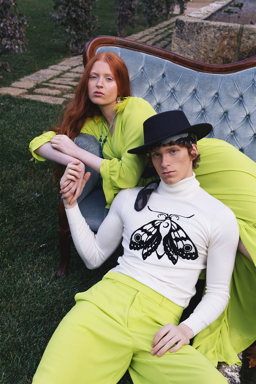 Lime green wide-leg trousers worn by a model.