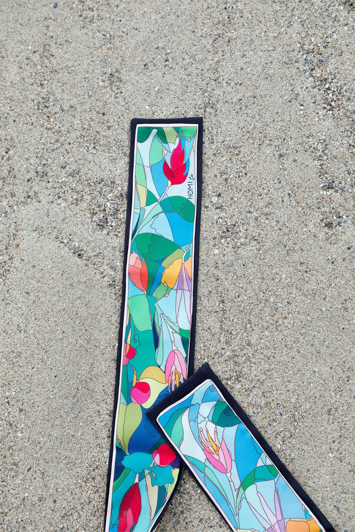 Pure silk scarf-tie, 130x8 cm, featuring a delicate stylized floral print with contemporary design.