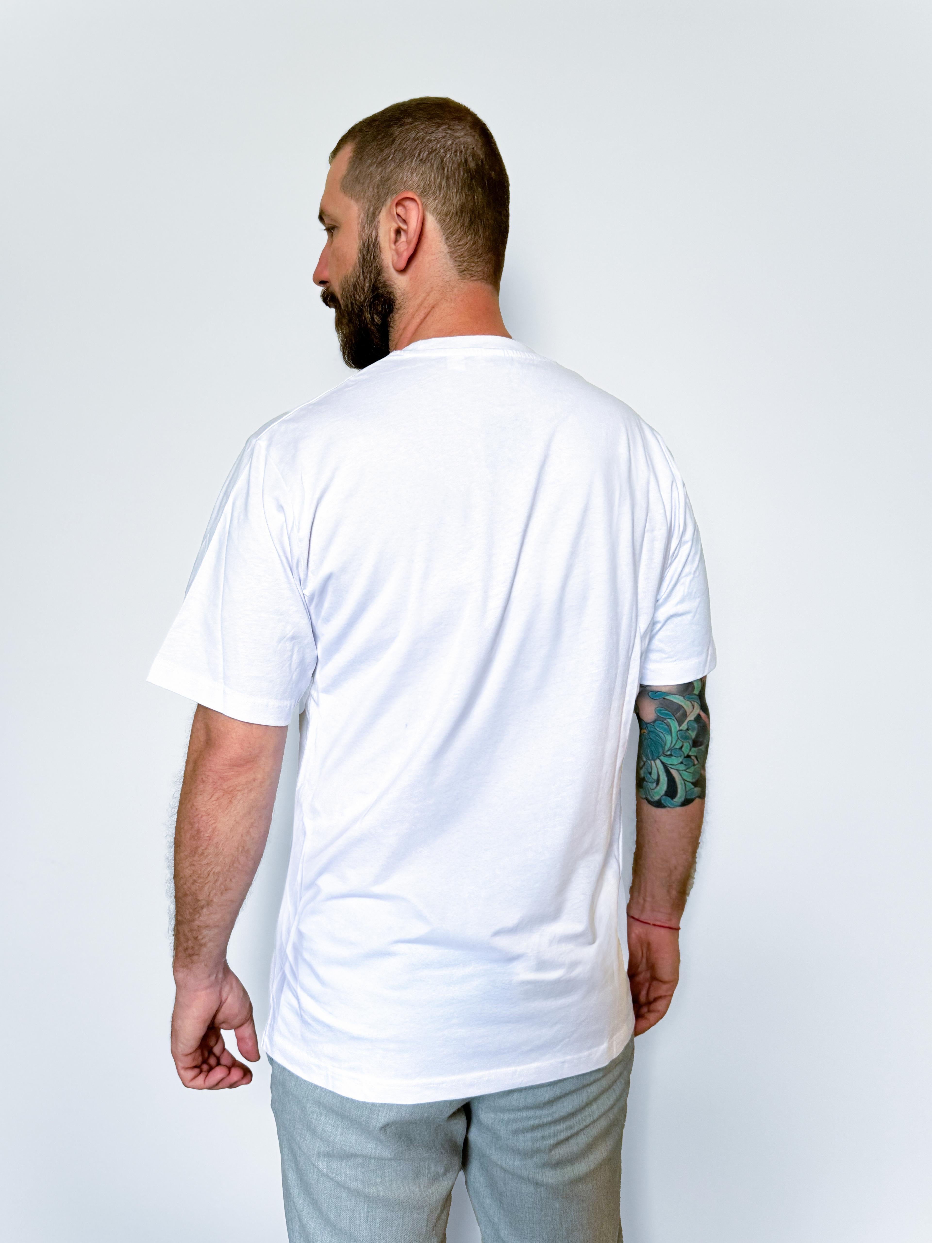 Back view of the white oversized unisex t-shirt worn by a model.