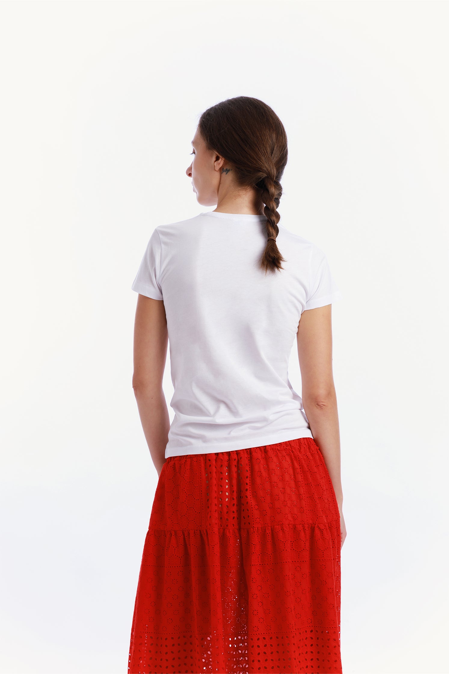 Back view of the slim-fit white T-shirt made of high-quality cotton, worn by a model.
