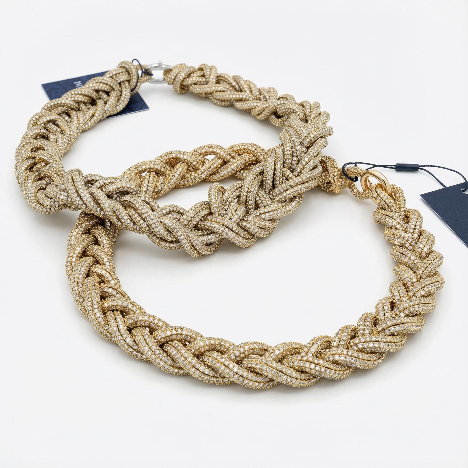 Gold handmade braided necklace made with luminous sparkling thread, three-dimensional design with metal ring closure.