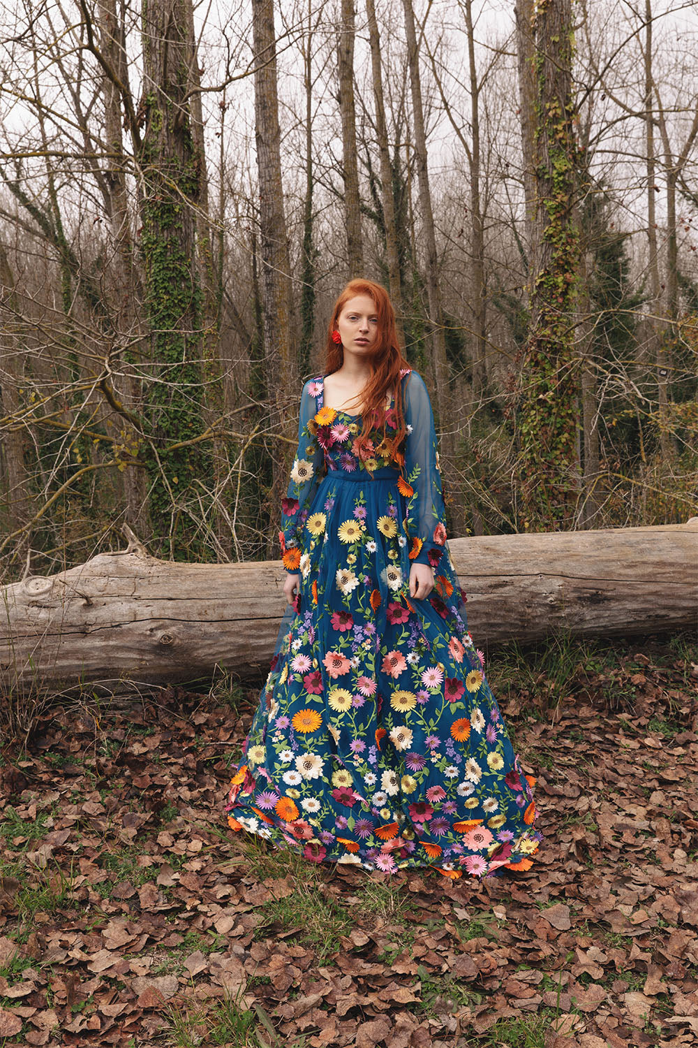 Blue floral embroidered dress worn by a model.