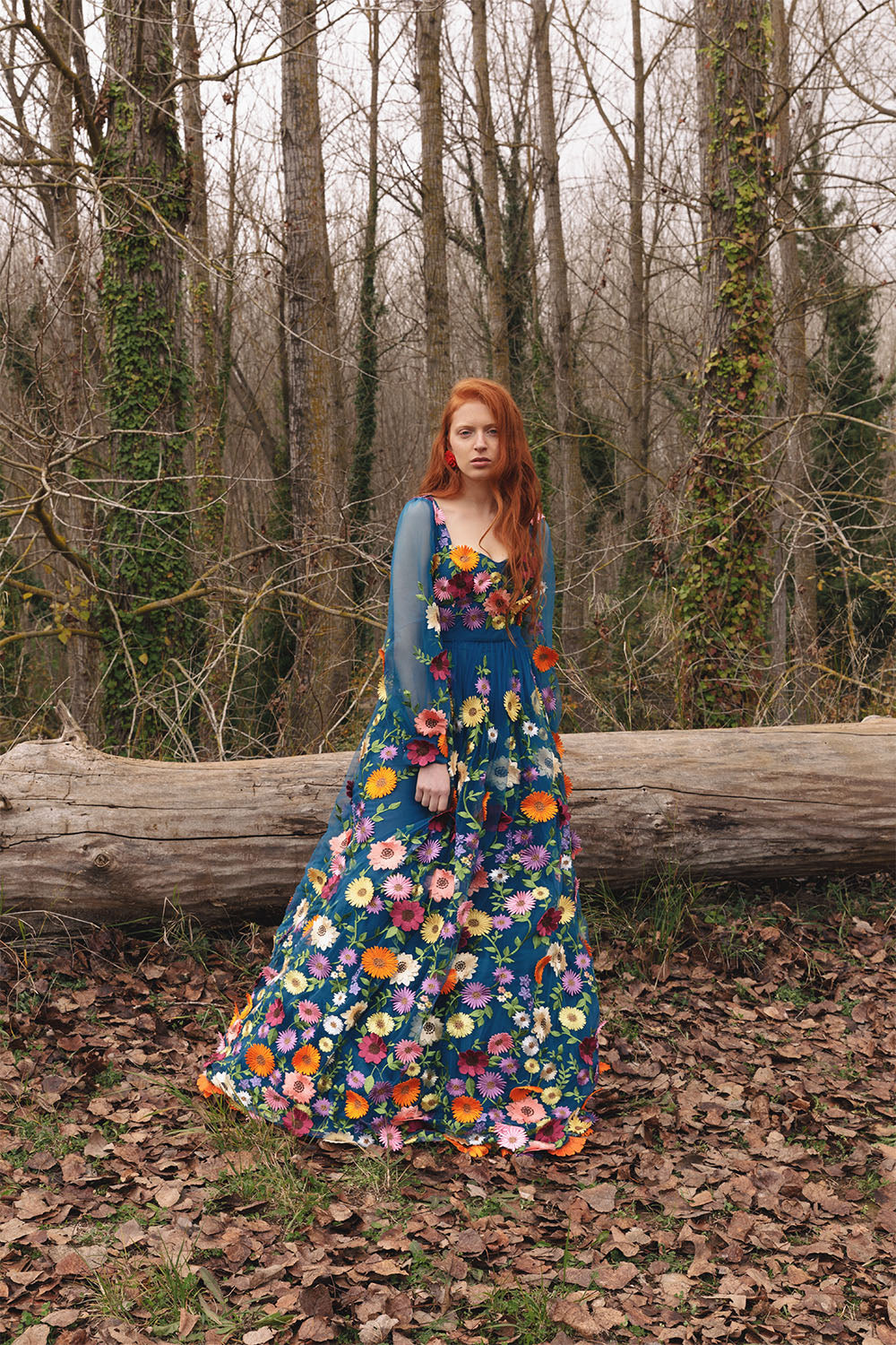 Blue floral embroidered dress worn by a model.