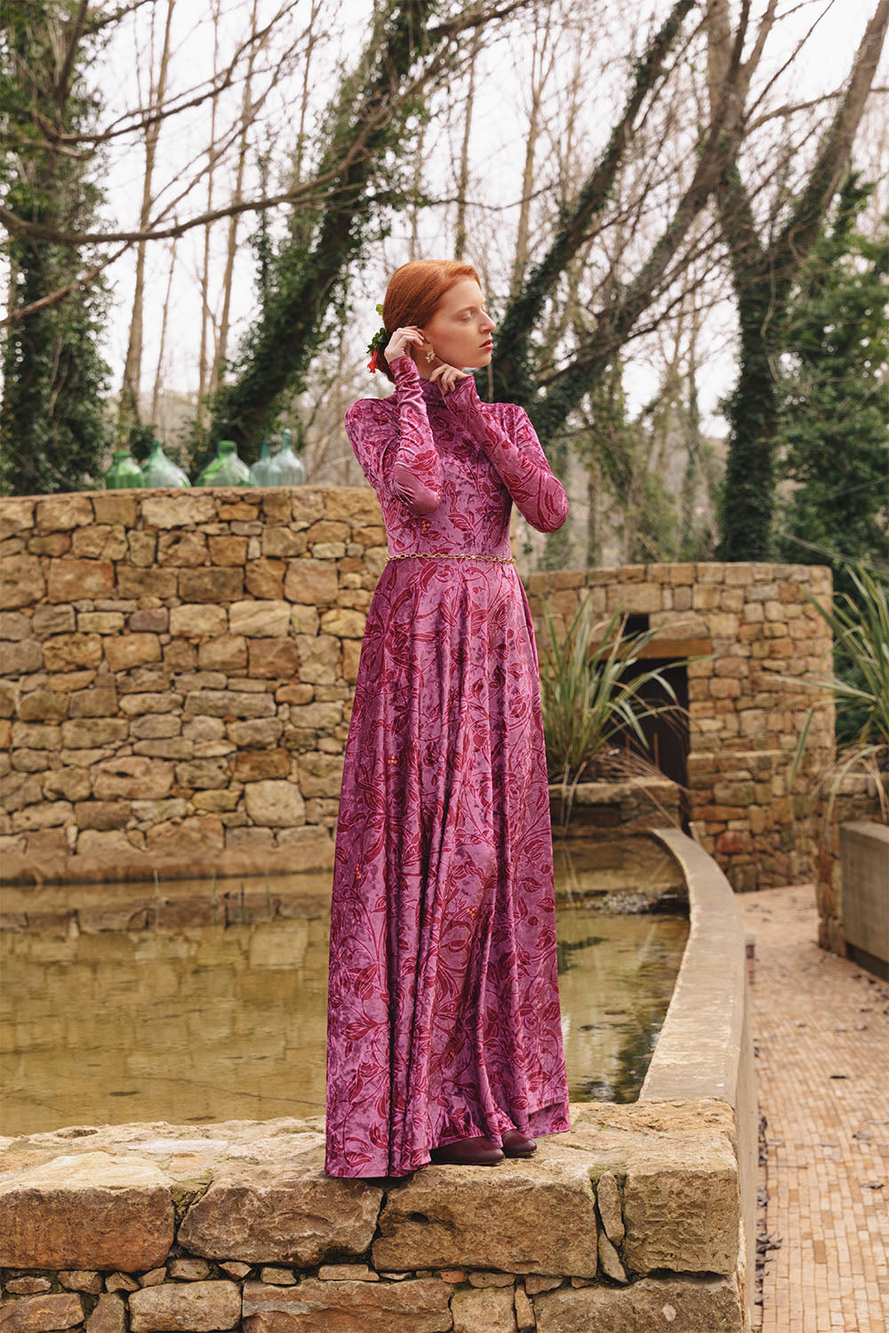 Velvet floral print dress with high neck worn by a model.