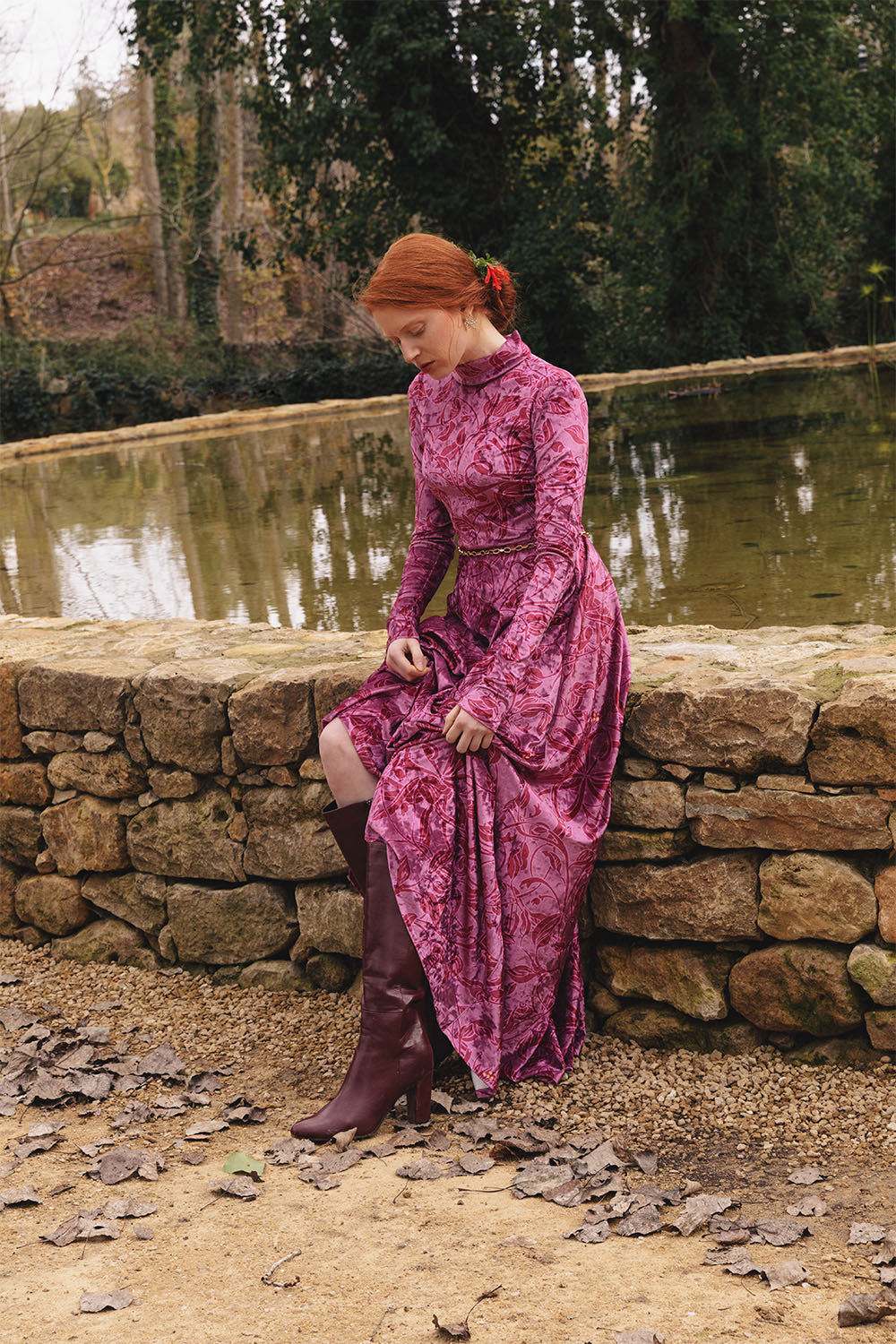 Velvet floral print dress with high neck worn by a model.