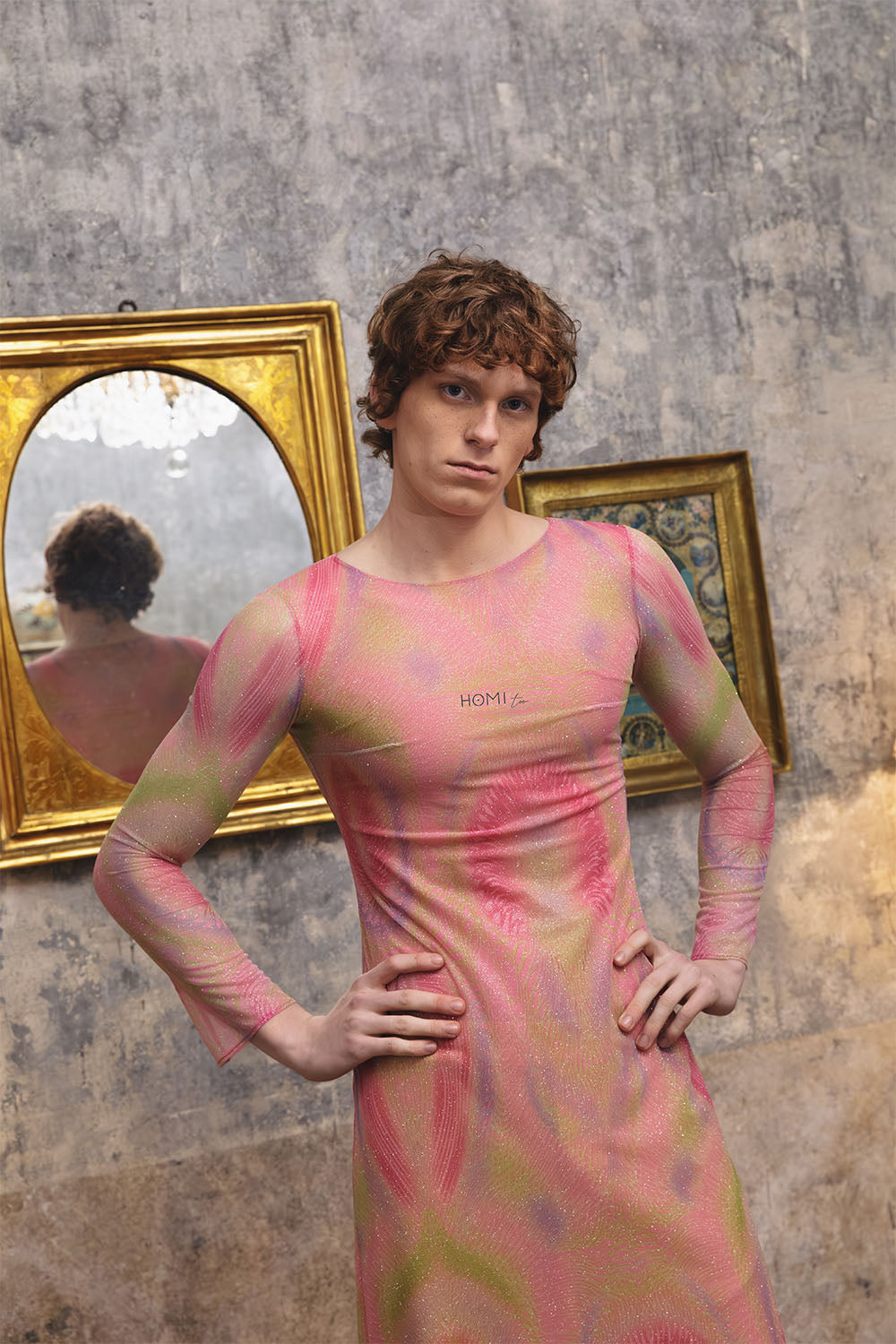 Pink printed sheer dress with long sleeves worn by a model.