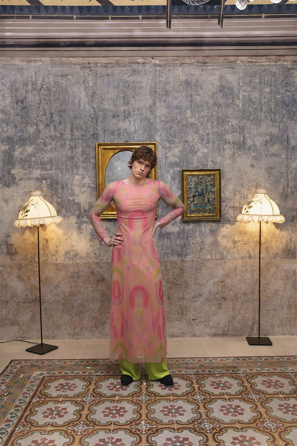 Pink printed sheer dress with long sleeves worn by a model.