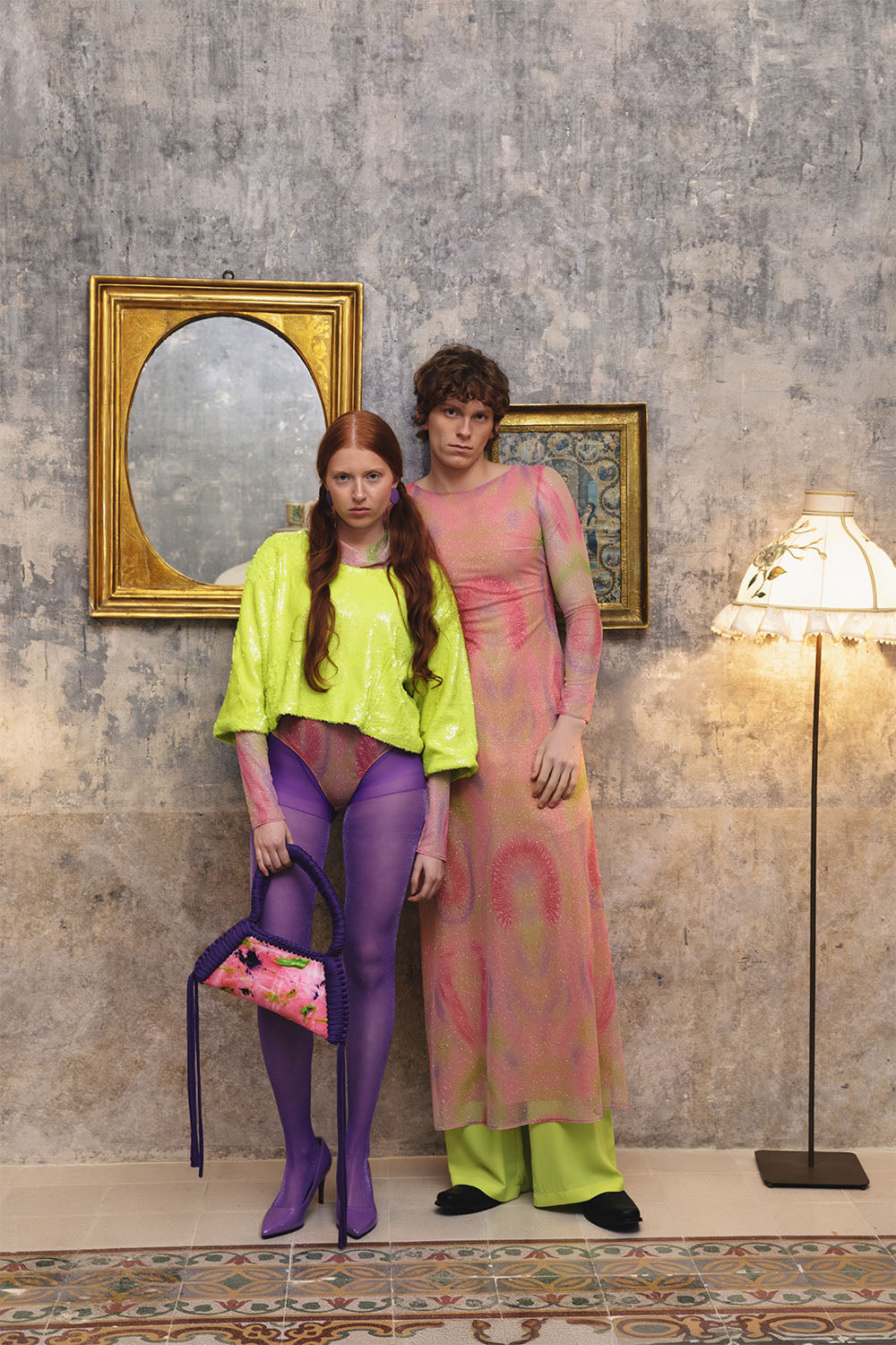 Pink printed tulle bodysuit with long sleeves worn by a model.