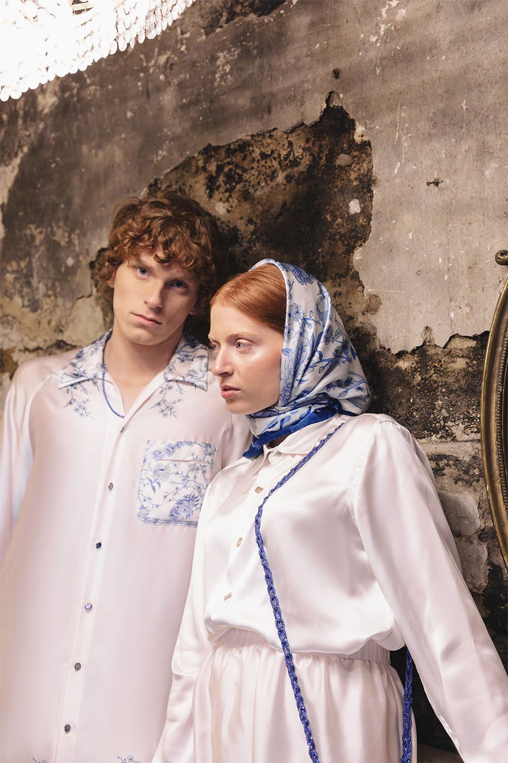 Ivory silk shirt with a classic pointed collar and long sleeves worn by a model.