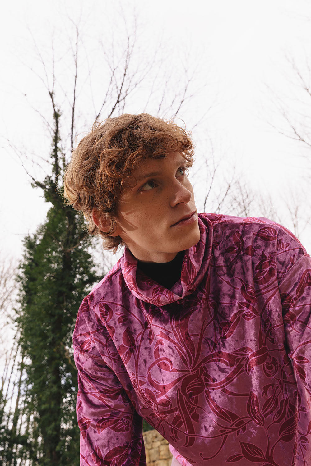 Velvet floral print top with cowl neck worn by a model.