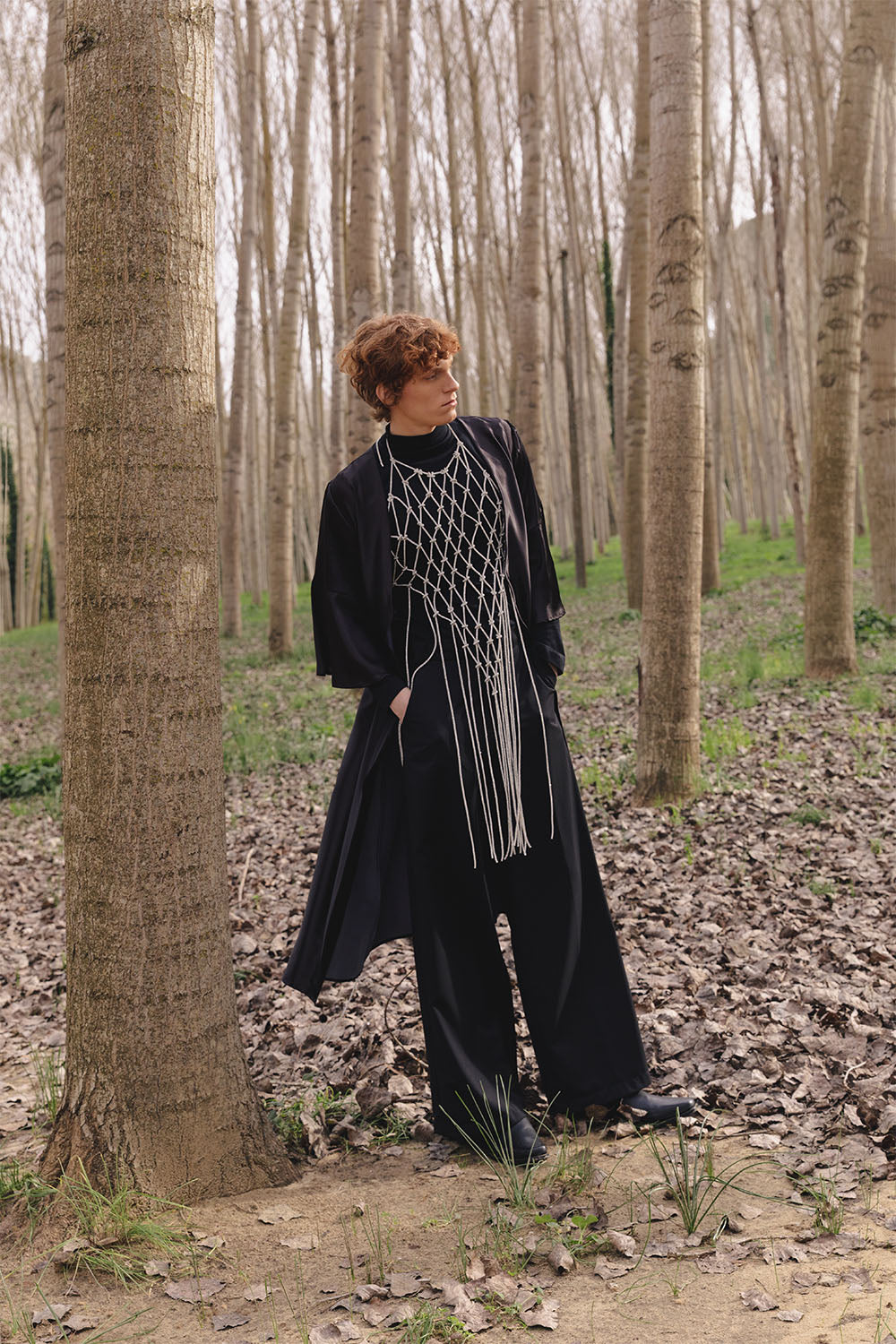 Black wide-leg trousers worn by a model.