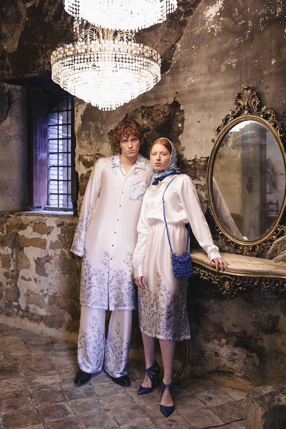 Ivory wide-leg trousers with blue floral details worn by a model.