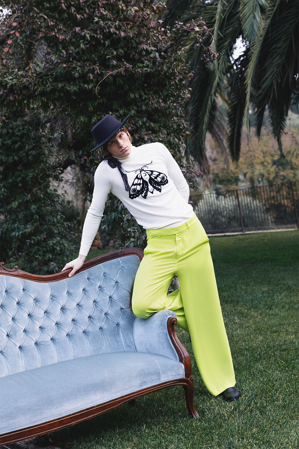 Lime green wide-leg trousers worn by a model.