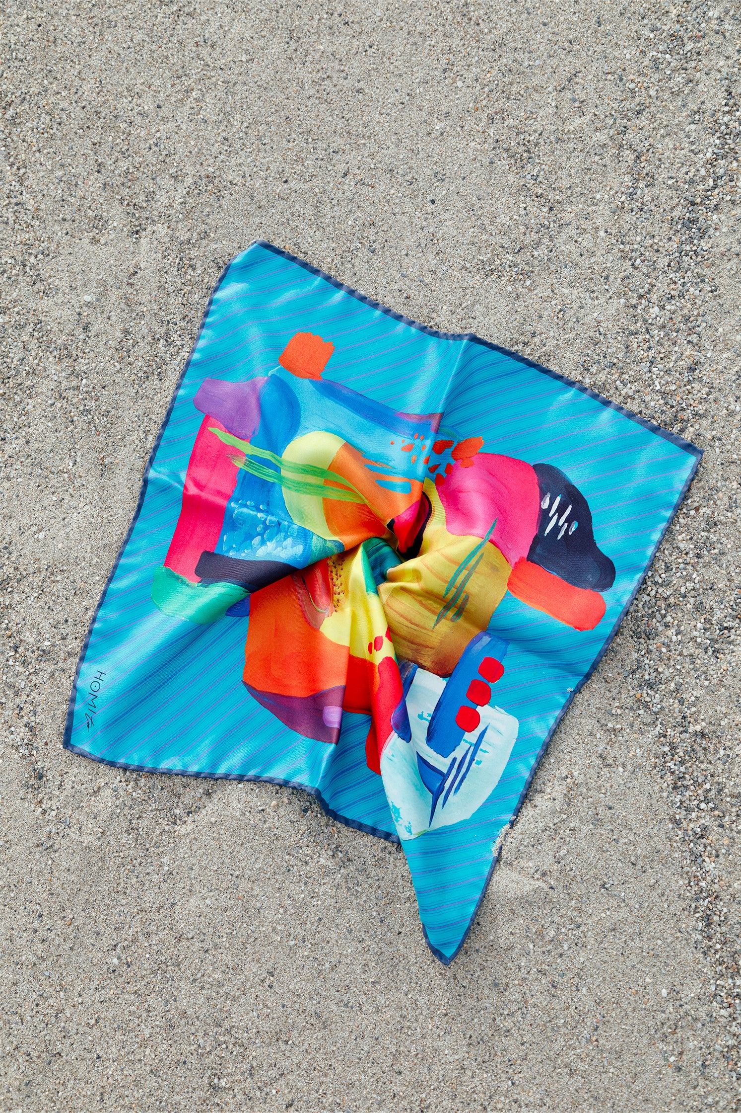 Silk scarf, 45x45 cm, featuring an abstract design with multicolor geometric shapes on a blue-toned base.
