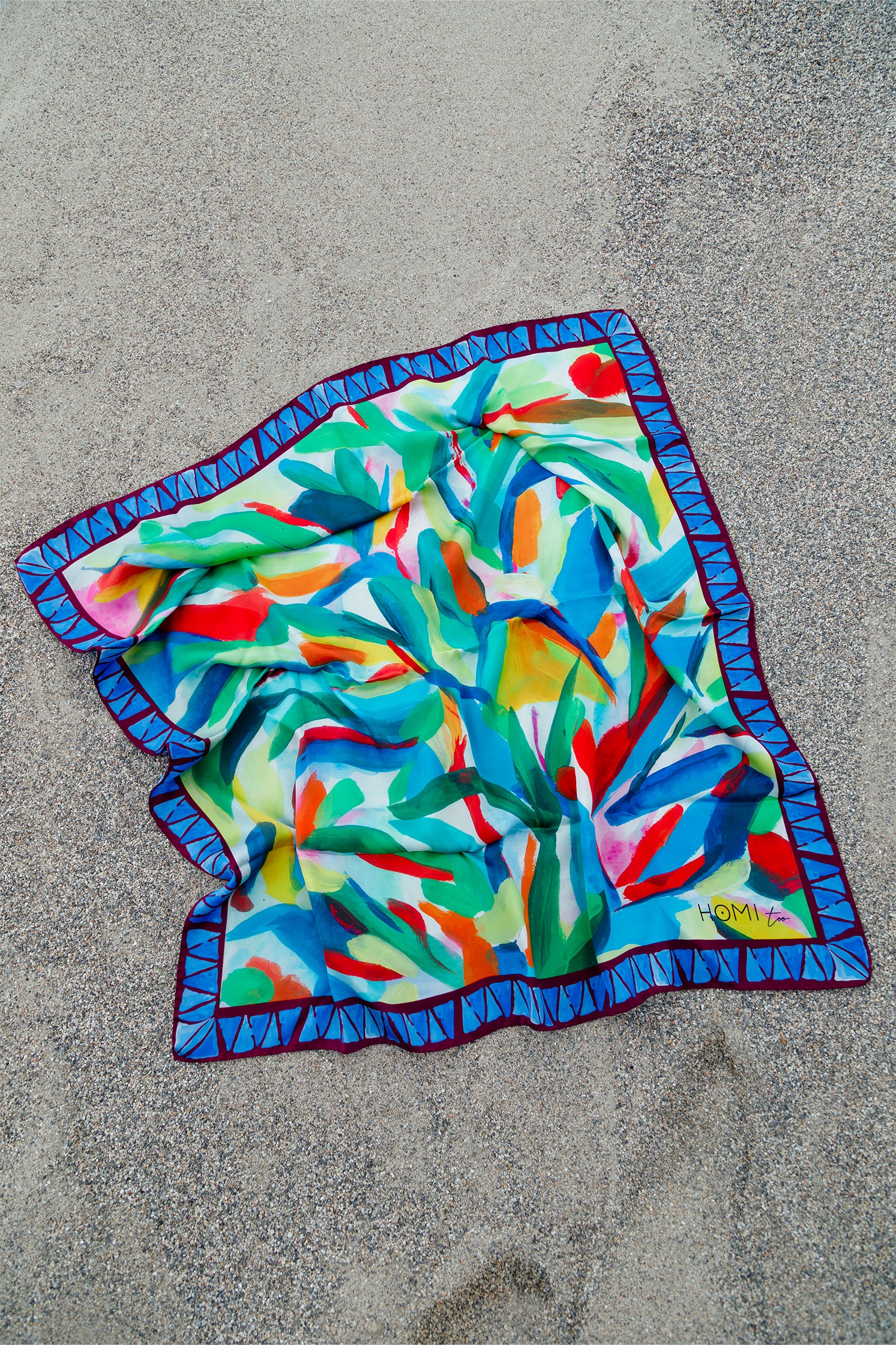 Pure silk scarf, 90x90 cm, featuring a stylized colorful leaf print inspired by an abstract painting, creating a harmonious and sophisticated composition.