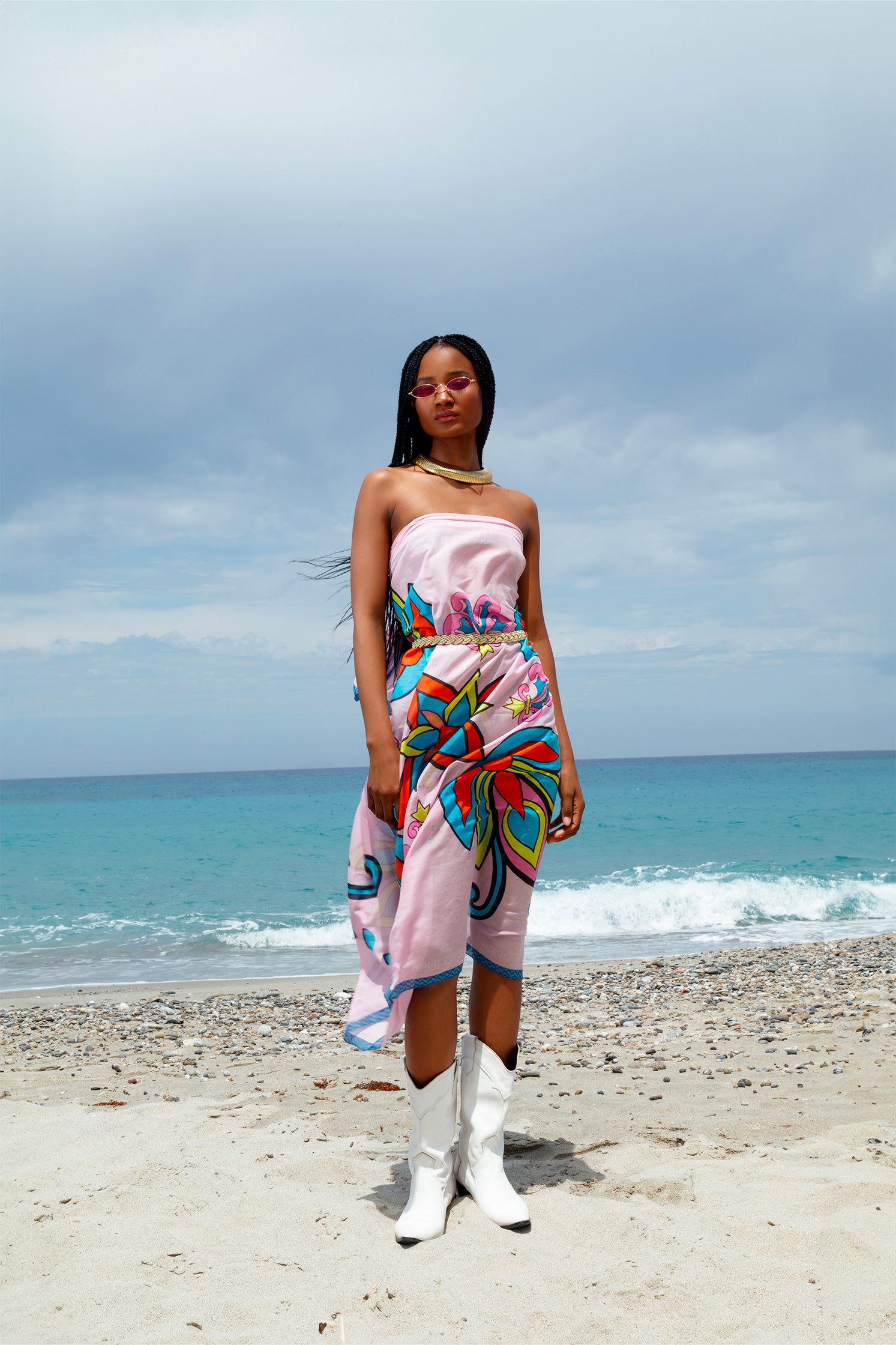 Pink geometric cotton and silk scarf styled as a dress on a model, showing versatility and elegant draping.