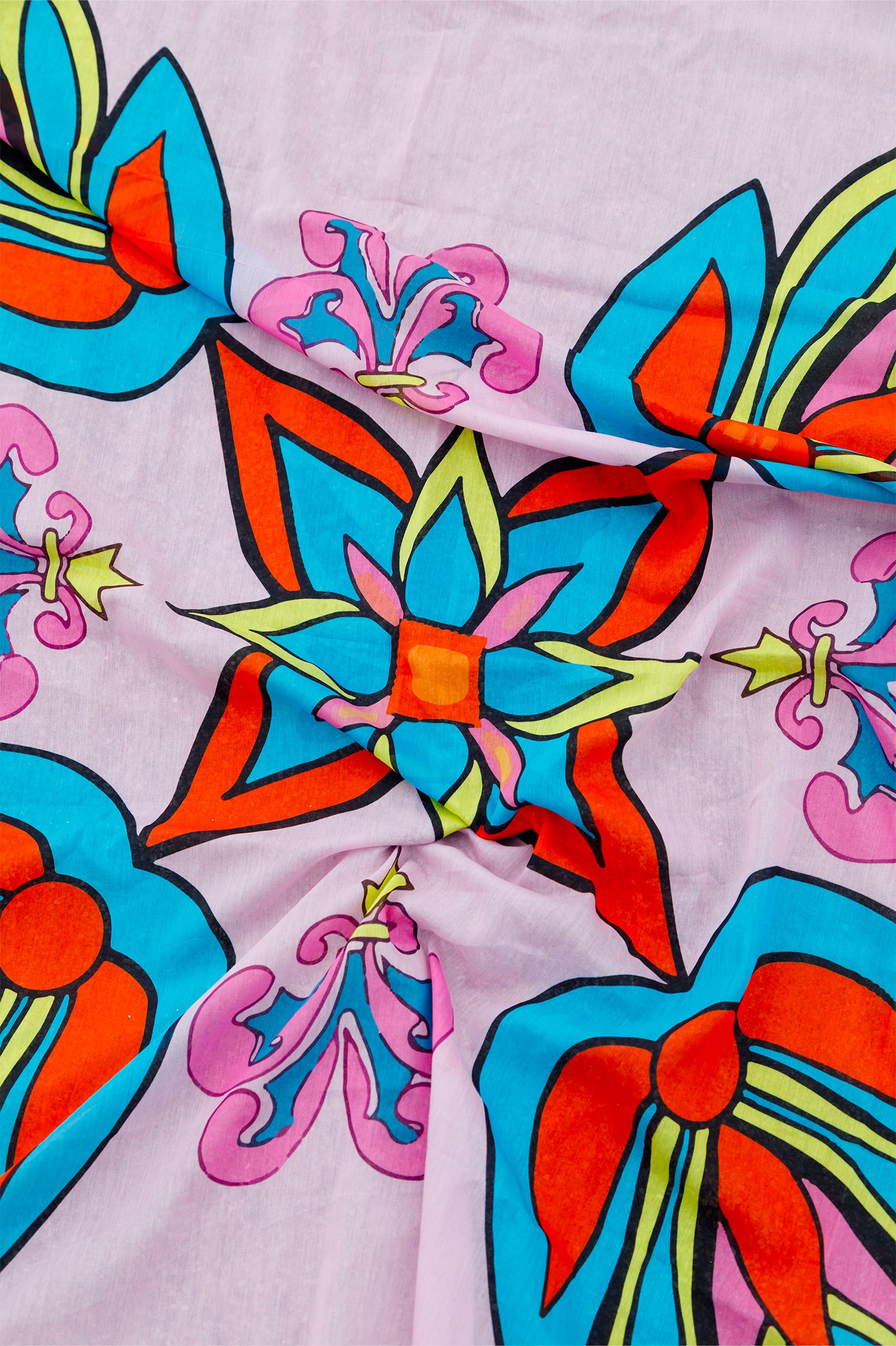 Close-up of the geometric pattern on the pink cotton and silk scarf, highlighting intricate design and fine weaving.