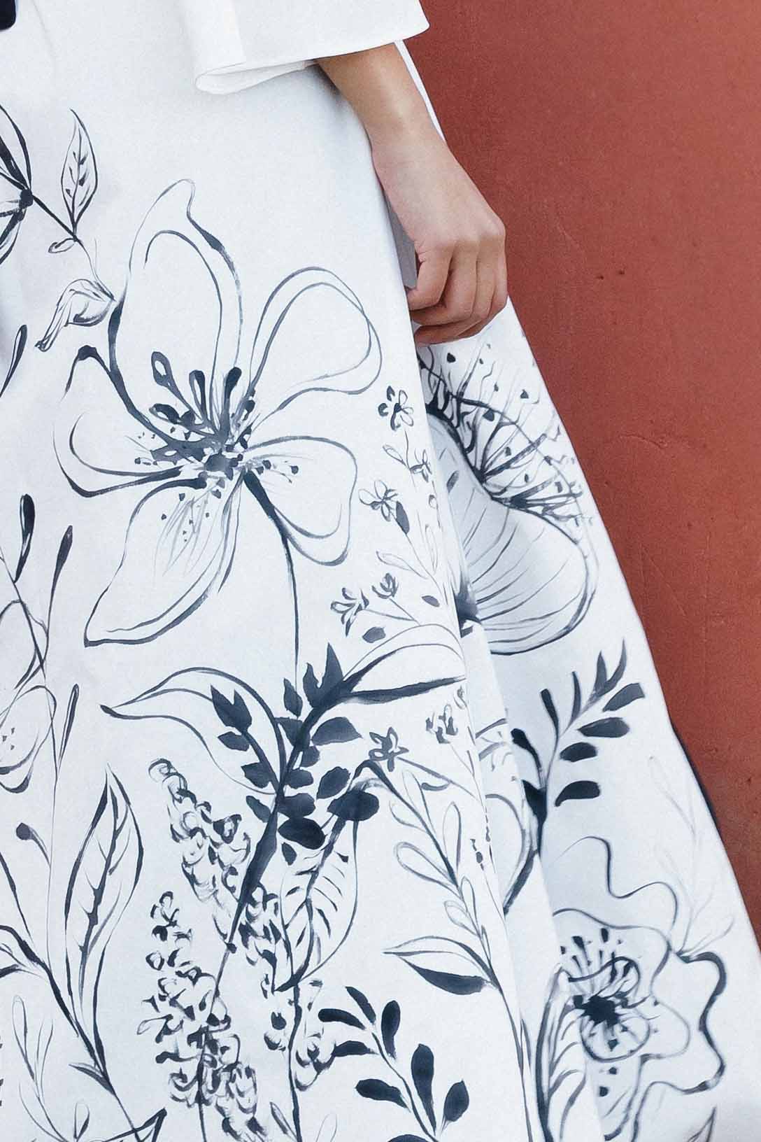 Close-up of the hand-painted floral illustration on the kimono fabric, showcasing the unique and artistic technique.